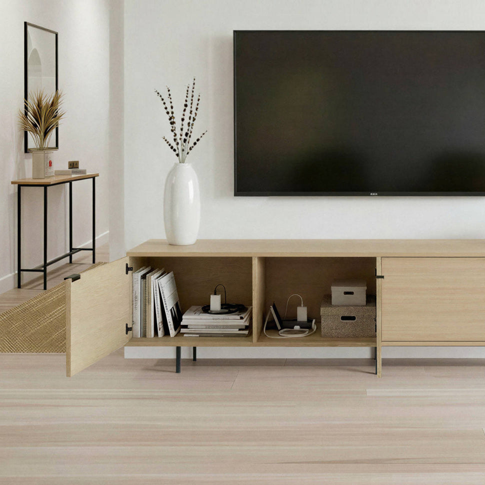 Open oak-toned Pau TV unit showing separate storage compartments beneath the television