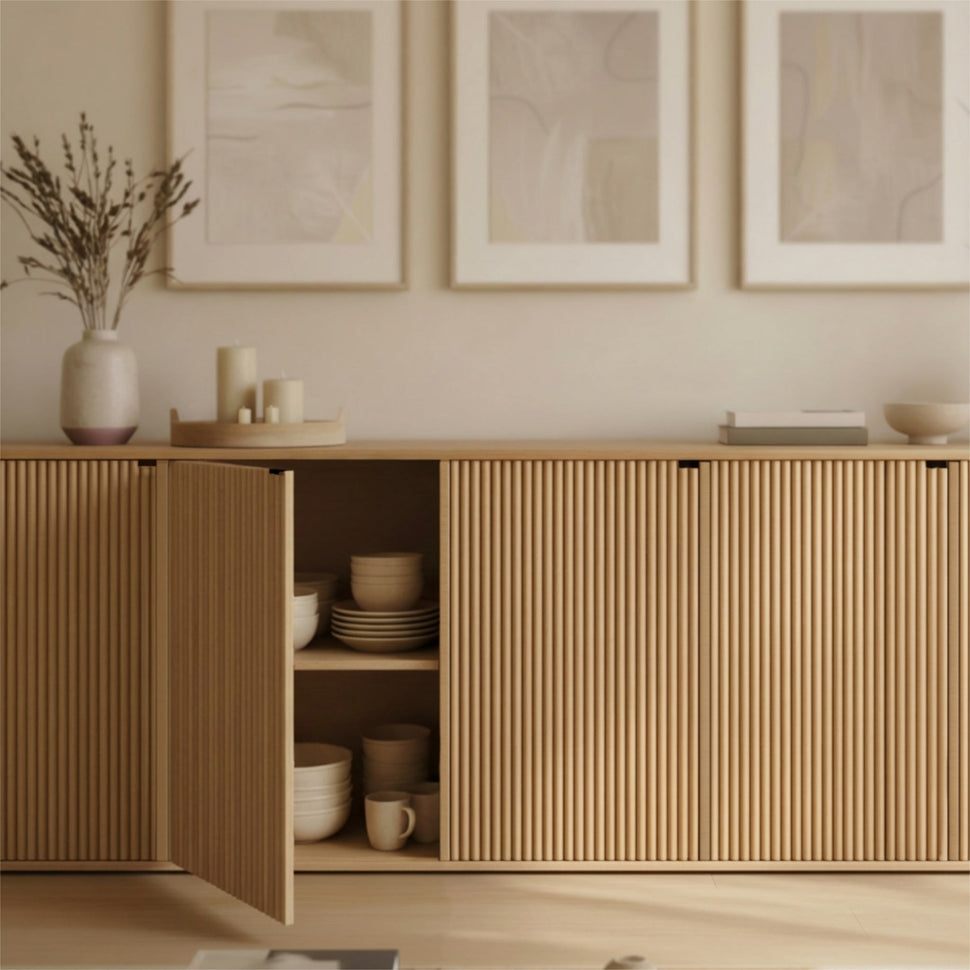 Open door of an oak-toned Pau sideboard showing a shelf with dishes