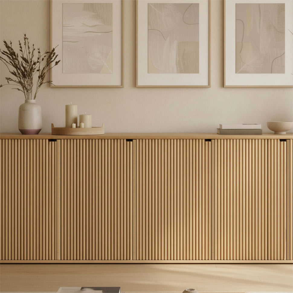 Front detail of an oak-toned Pau sideboard with textured doors and objects on top
