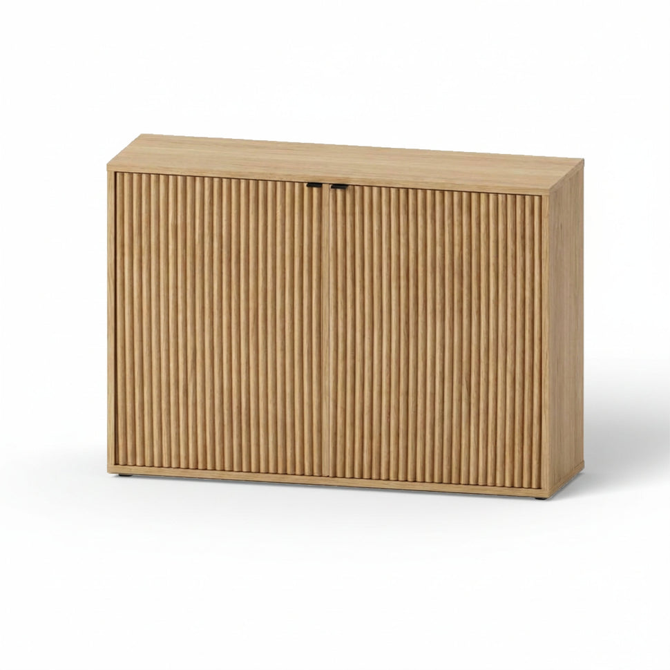 Pau two-door sideboard with textured fronts and an oak-toned finish, viewed at an angle