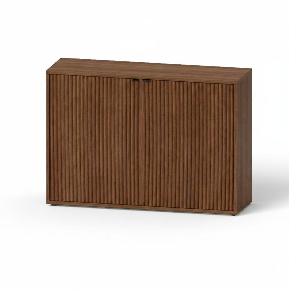 Pau two-door sideboard with textured fronts and a walnut-toned finish, viewed at an angle