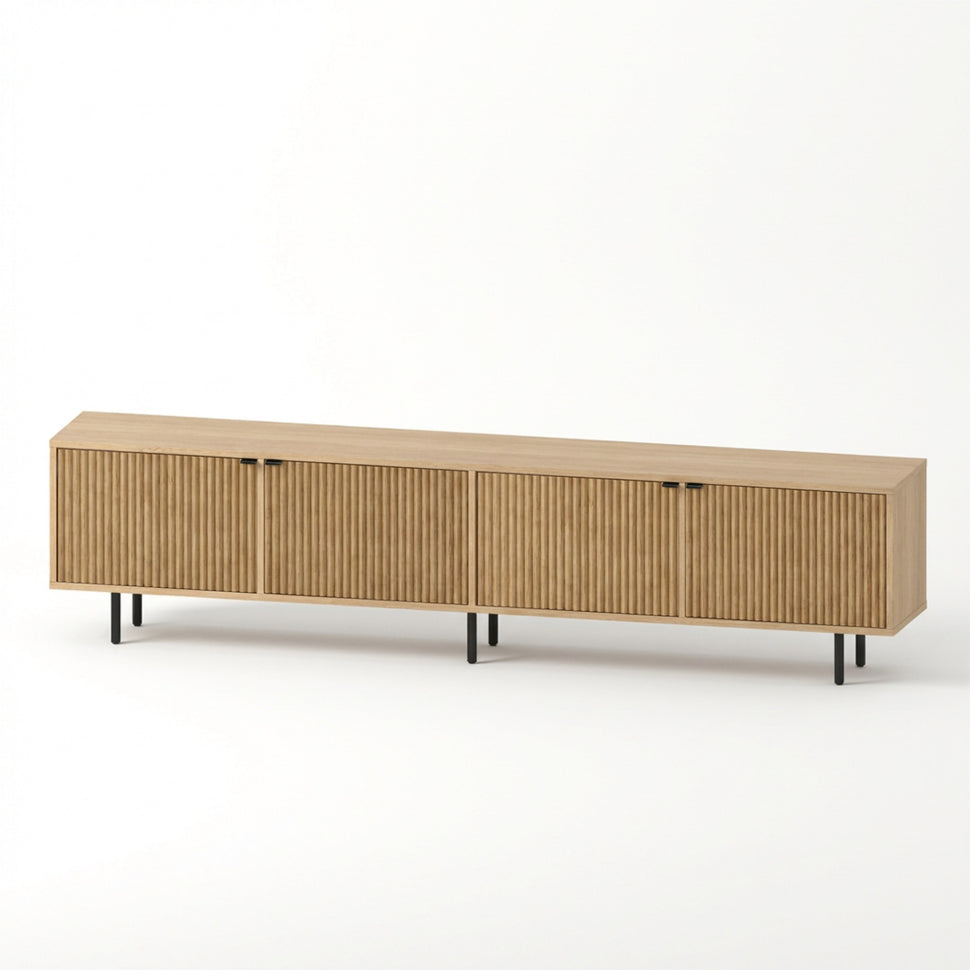 Pau four-door TV unit with textured fronts and an oak-toned finish, viewed at an angle