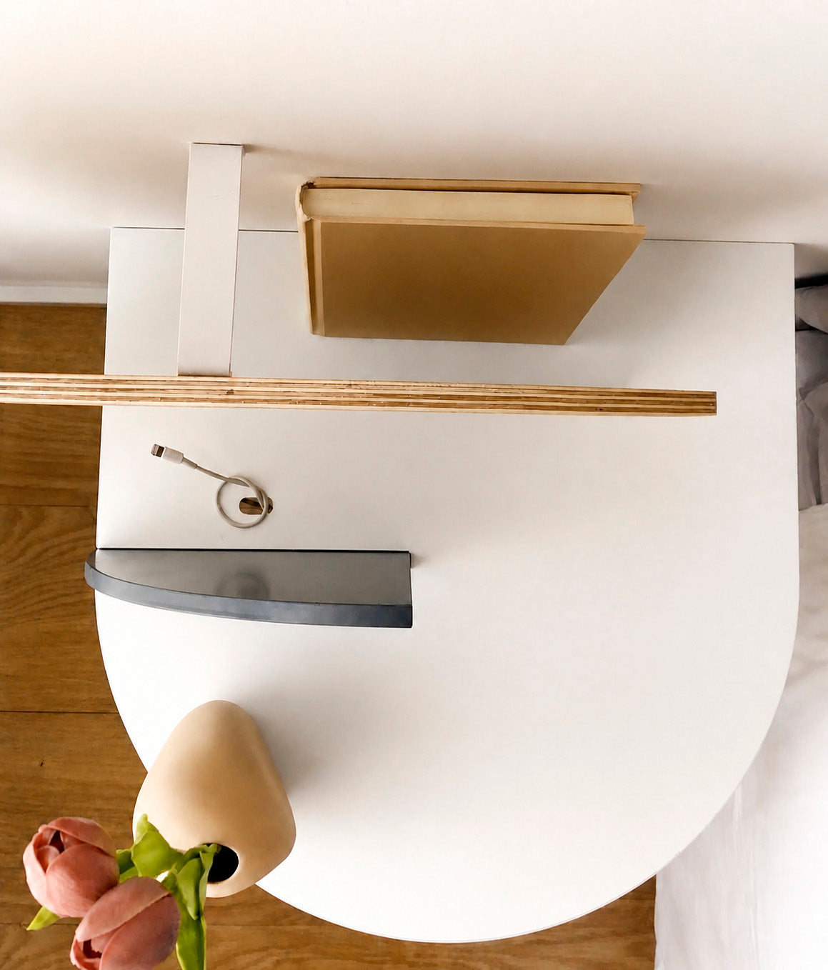 Top view of the Alba floating bedside table showing the cable opening and rear storage space.