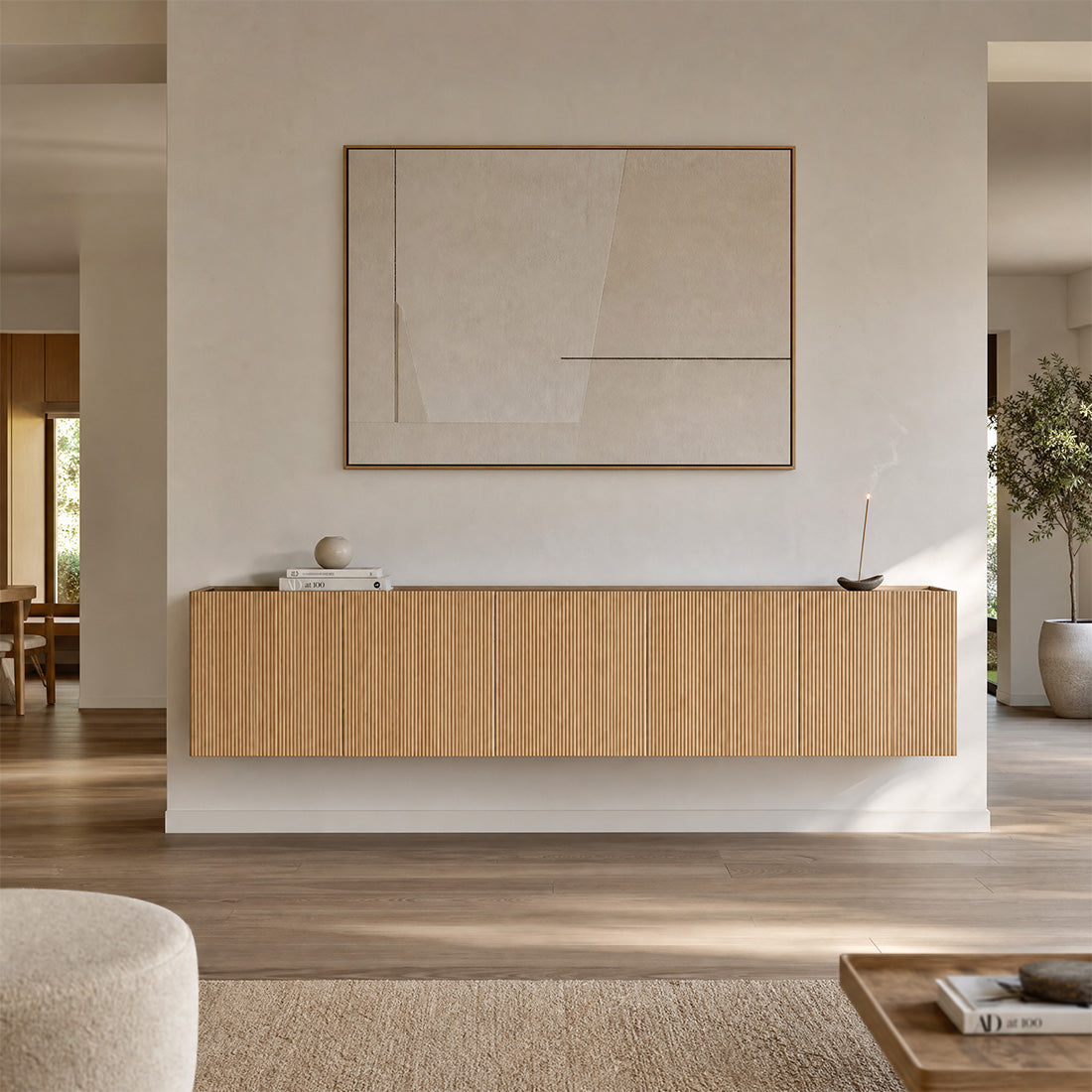 Five-module Dalea floating sideboard in oak with vertically grooved fronts in a living room