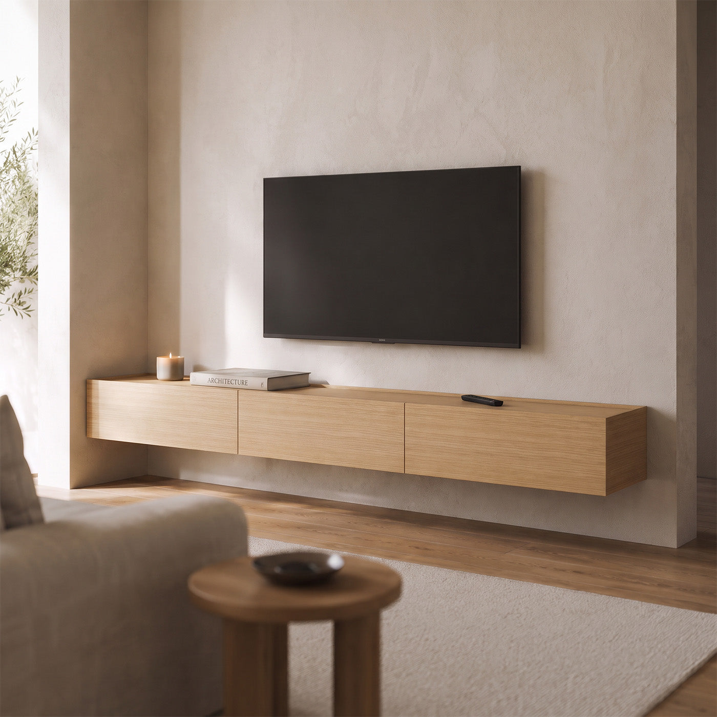 Three-module Dalea floating TV unit in oak mounted beneath a television