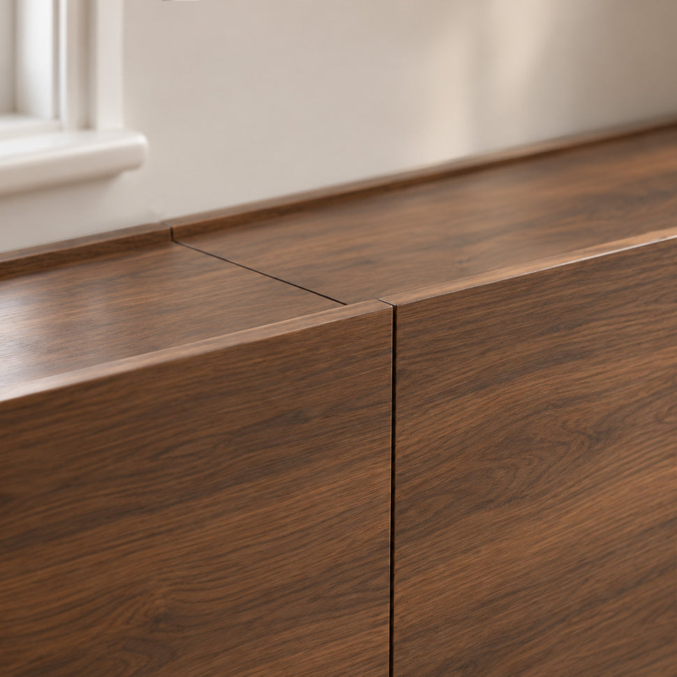 Close-up of the central joint and aligned tops of two walnut-finish Dalea XL bodies