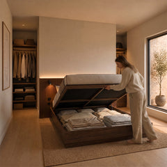 Stoa walnut lift-up storage bed frame open in a bedroom, showing under-bed storage in use